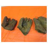 3 old baseball mits