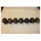 chalkware heads wall hanging