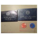 2- Ikes unc. silver dollars