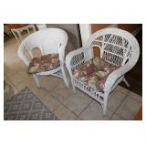 2 white wicker chairs