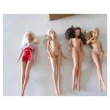 4 barbie dolls
