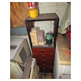 wood cabinet and items on it