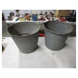 2 galvanized milking buckets