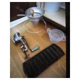 colander,cast iron corn pan,meat grinder & items
