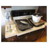 oster cooker,utencils,pans & small paper cups