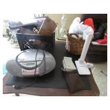 sony radio/cd player & items on top of card table