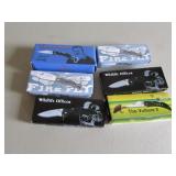 6 smaller knives in boxes