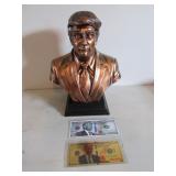 trump statue & 2 bills