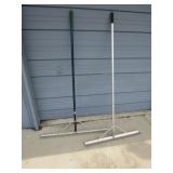 2 landscapers rakes