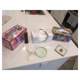 kleenexes,magnifier & flashlight