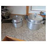 2 pressure cookers w/whistles