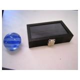 small black showcase & blue glass ball