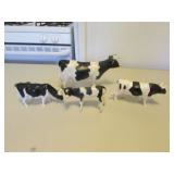 4 plastic cows