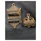 two cast iron match holders