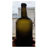 Early green gin or whiskey bottle