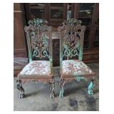 Pair of Ornate Carved Wood Chairs with Cowhide Uph