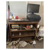 Shelf, tech books, brief case, computer screens