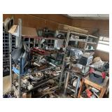3 metal racks on castors and contents