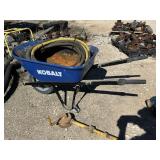 barrel hand pump, wheelbarrow, hose,