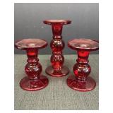 3 red glass candleholders.  Tallest is 7in,