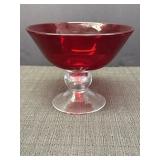 Hand blown red glass bowl on clear pedestal,