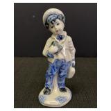 Ceramic boy figurine, possibly a salesman, Delft?