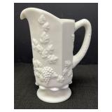 Milk glass paneled pitcher w/grapevine design.