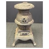 Vtg miniature cast iron Blaze pot belly stove.