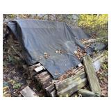Misc pieces of lumber - covered with tarps