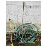 Garden hose, mole trap, broom, & part of an edger