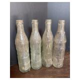 (4) Embossed South Bend Bottles