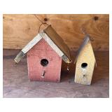 2 wood birdhouses, tallest is 9in.  Both have bird