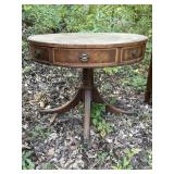 Round 2 drawer wood table, leather top, base has 4