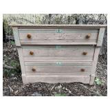 3 drawer wood dresser.  Top covering is peeling &