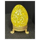 Yellow & white speckled glass egg paperweight on