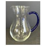 Clear hand blown glass pitcher w/blue handle, 8in