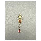 W.C.Co drop pendant w/2 red stones, leaf accent,
