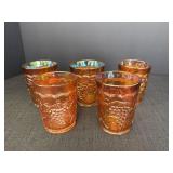 5 Marigold Carnival Glass tumblers, grapevine