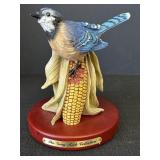 The gray rock collection blue jay on ear of corn