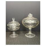 2 clear glass compotes w/lids.  8 & 10in heights.