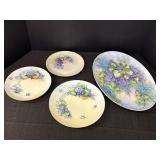 4 purple & blue floral plates, non matching.