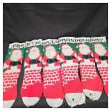 (11) 24in Stockings w/ Santa, Bells, & Names