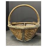 Woven basket with handle and braided details