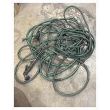 2 misc. green hoses w nozzle attachment