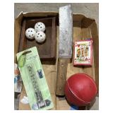 Small wood box with 3 plastic wiffle balls, rain