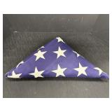 Properly folded United States flag, 24 x 16 x 16in