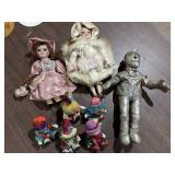 Set of sitting clowns, plush tin man, & 2 dolls -