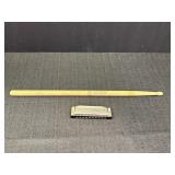 Hohner harmonica & pro mark drumstick.