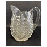 Heavy pressed glass pitcher with drape design,