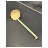 Green & cream enamel ladle, 11in.  Shows wear.